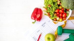 Diet Health Plan Workout planing Sport exercise equipment workout and gym background with nutrition fresh salad for fitness style Healthy Lifestyle Concept