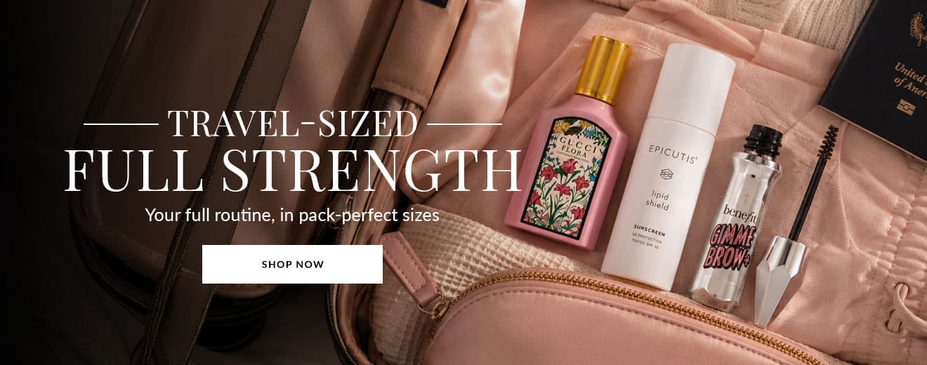Travel-size beauty products laid out in a pink bag for a promo banner: full strength, compact routine ready-to-go.
